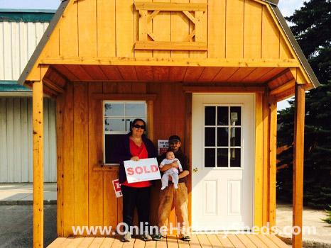 A family happy with their new Hickory Shed
